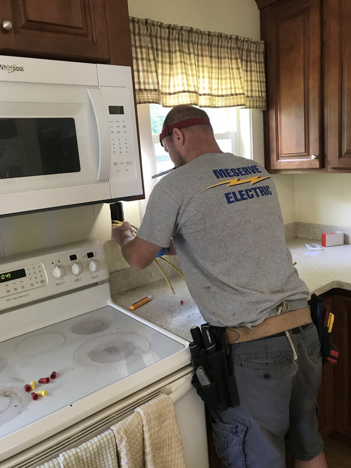 A Meserve electrician wiring a kitchen